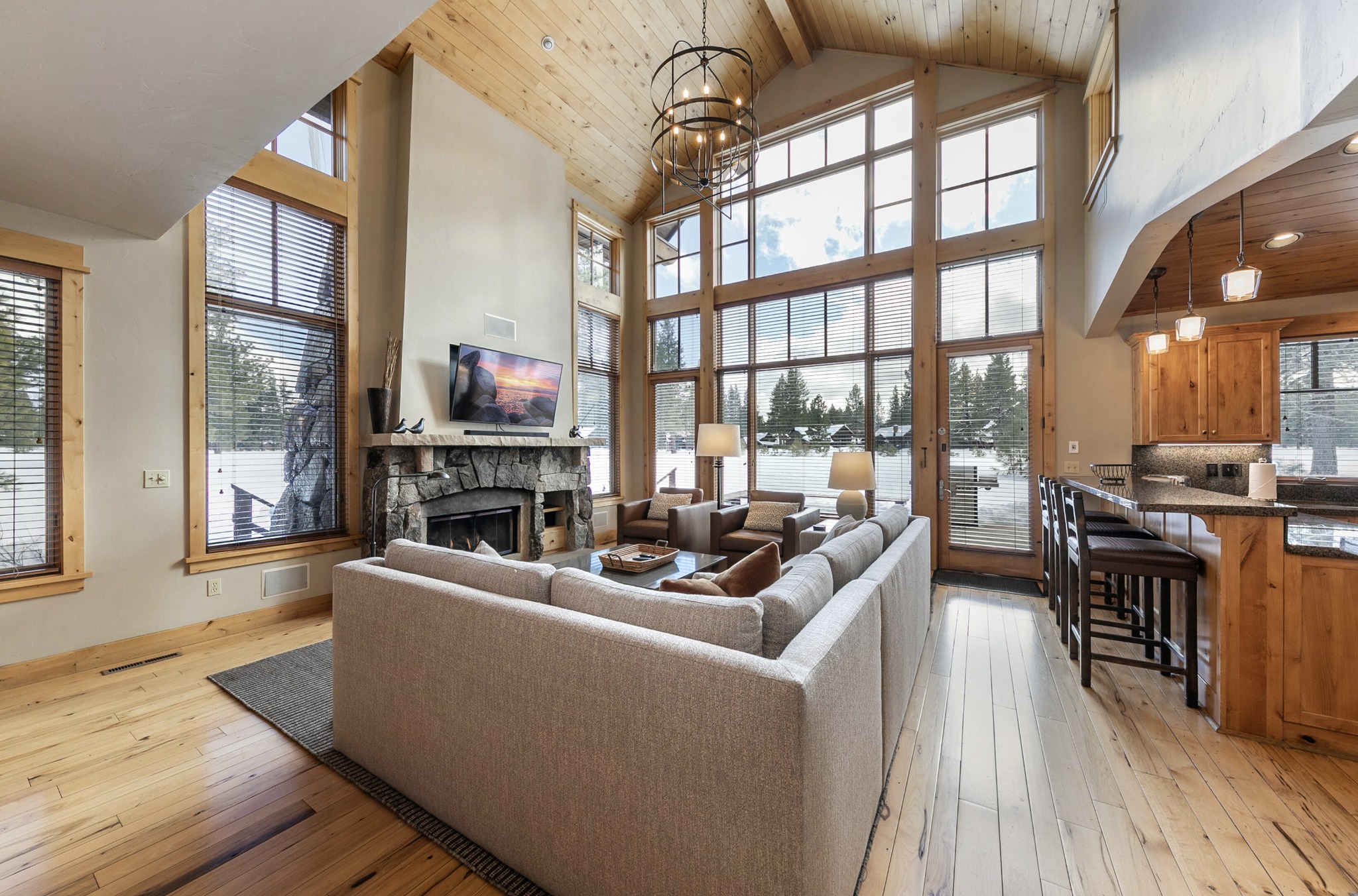 couch in the center of a living room in a mountain lodge