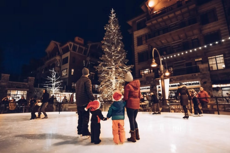 a family ice skating at night